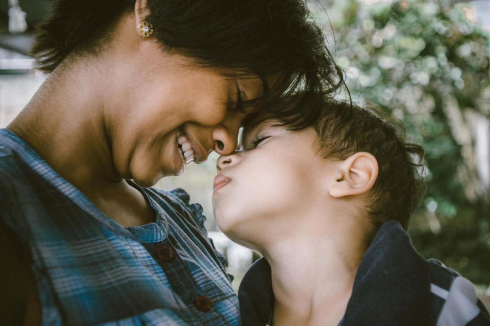 A mother and child look at each other